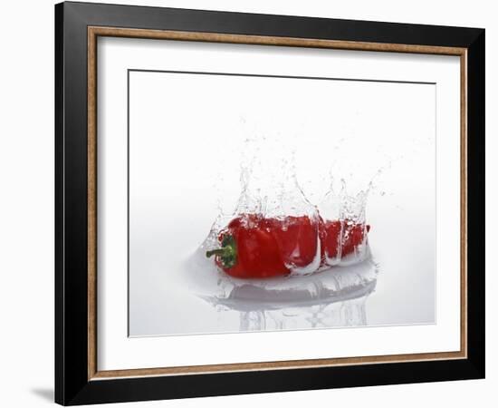 A Red Chilli Pepper Falling into Water-Kröger & Gross-Framed Photographic Print