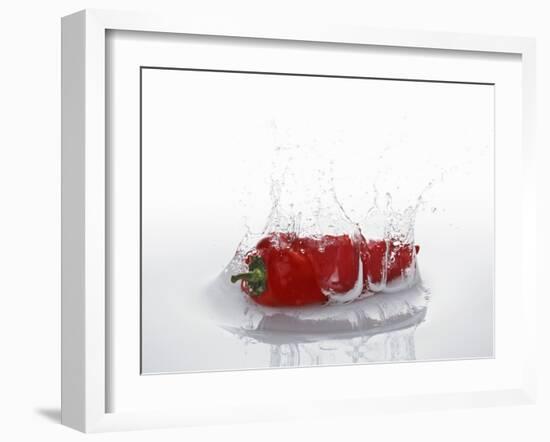 A Red Chilli Pepper Falling into Water-Kröger & Gross-Framed Photographic Print