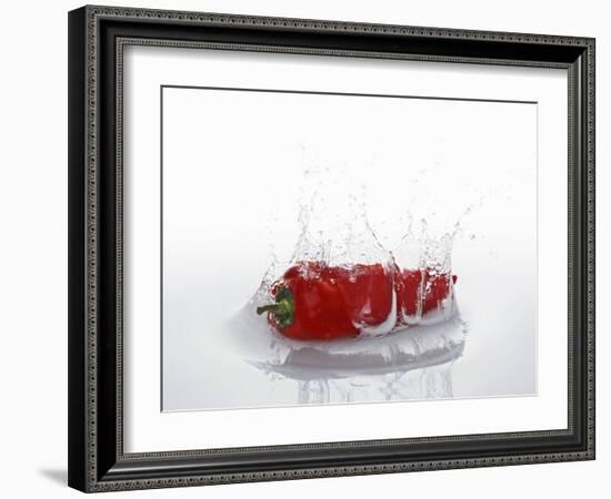 A Red Chilli Pepper Falling into Water-Kröger & Gross-Framed Photographic Print