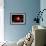 A Red Giant Star System-null-Framed Art Print displayed on a wall