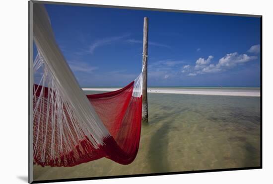 A Red Hammock Spread Out by the Wind Swings Above the Water During Low Tide, Hobox Island, Mexico-Karine Aigner-Mounted Photographic Print