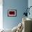 A red spiral-Inge Schuster-Framed Photographic Print displayed on a wall
