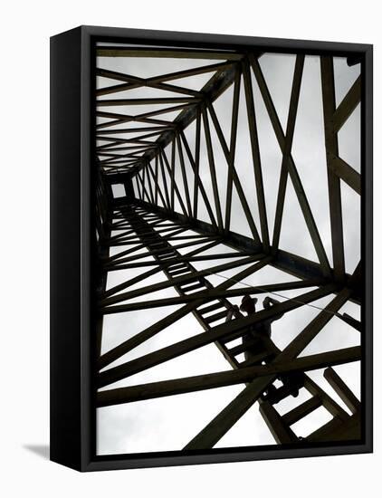 A Reenactor is Silhouetted Inside a Replica of the Spindletop Oil Derrick-null-Framed Premier Image Canvas