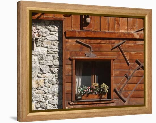 A Rich Wooden Wall with Rustic Tools and Window and a Stone Wall-null-Framed Premier Image Canvas