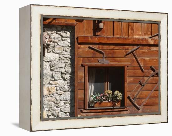 A Rich Wooden Wall with Rustic Tools and Window and a Stone Wall-null-Framed Premier Image Canvas