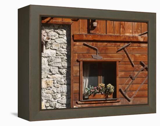 A Rich Wooden Wall with Rustic Tools and Window and a Stone Wall-null-Framed Premier Image Canvas