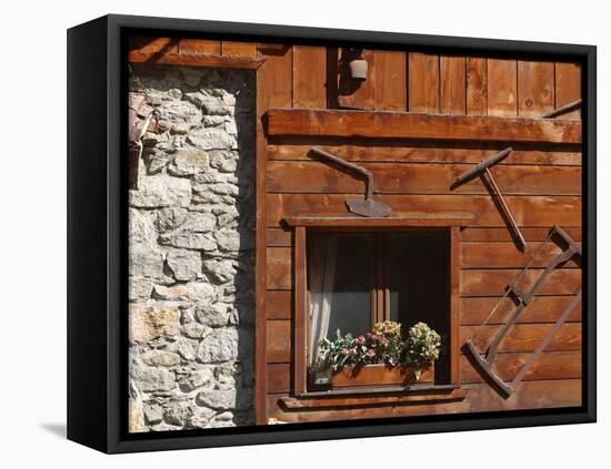 A Rich Wooden Wall with Rustic Tools and Window and a Stone Wall-null-Framed Premier Image Canvas