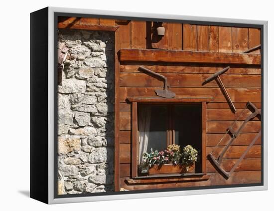 A Rich Wooden Wall with Rustic Tools and Window and a Stone Wall-null-Framed Premier Image Canvas