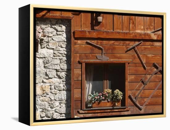 A Rich Wooden Wall with Rustic Tools and Window and a Stone Wall-null-Framed Premier Image Canvas