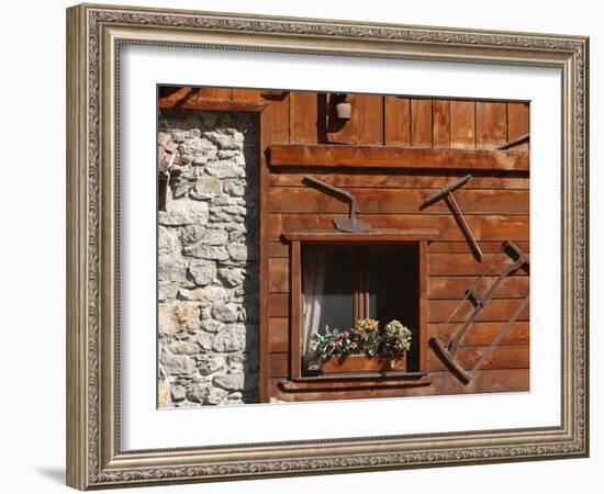 A Rich Wooden Wall with Rustic Tools and Window and a Stone Wall-null-Framed Photographic Print