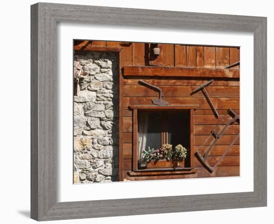 A Rich Wooden Wall with Rustic Tools and Window and a Stone Wall-null-Framed Photographic Print