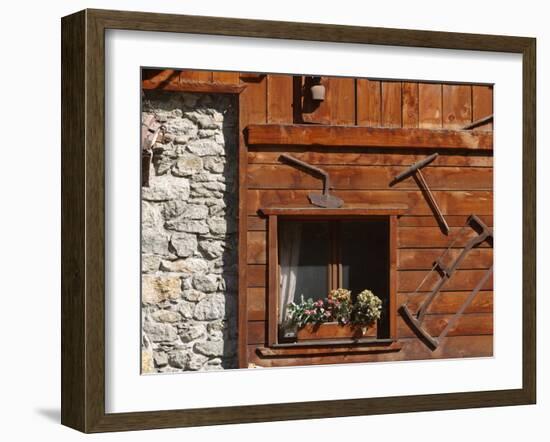 A Rich Wooden Wall with Rustic Tools and Window and a Stone Wall-null-Framed Photographic Print