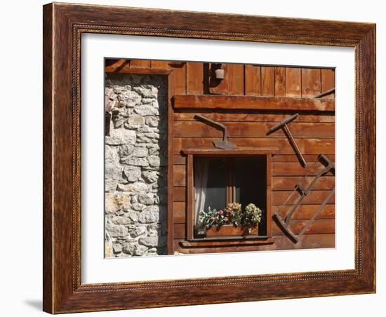 A Rich Wooden Wall with Rustic Tools and Window and a Stone Wall-null-Framed Photographic Print