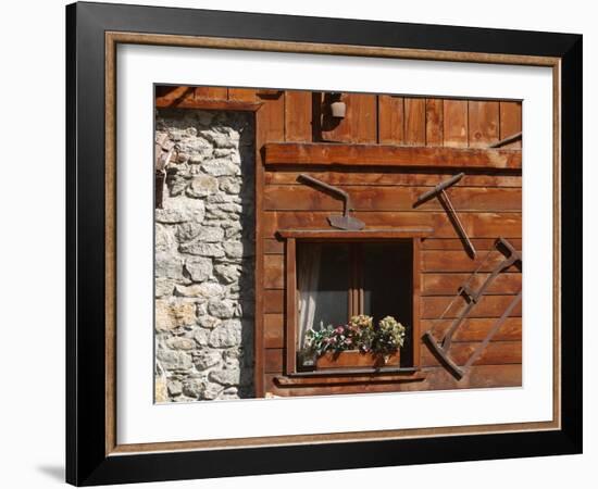 A Rich Wooden Wall with Rustic Tools and Window and a Stone Wall-null-Framed Photographic Print