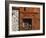 A Rich Wooden Wall with Rustic Tools and Window and a Stone Wall-null-Framed Photographic Print