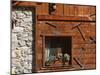 A Rich Wooden Wall with Rustic Tools and Window and a Stone Wall-null-Mounted Photographic Print