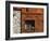 A Rich Wooden Wall with Rustic Tools and Window and a Stone Wall-null-Framed Photographic Print