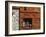 A Rich Wooden Wall with Rustic Tools and Window and a Stone Wall-null-Framed Photographic Print