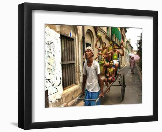 A Rickshaw Puller Carries Supporters of Brazil Soccer Team-null-Framed Photographic Print