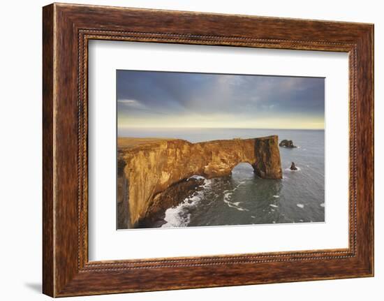 A rock arch on Dyrholaey Island seen in sunset sunlight, near Vik, south coast of Iceland-Nigel Hicks-Framed Photographic Print