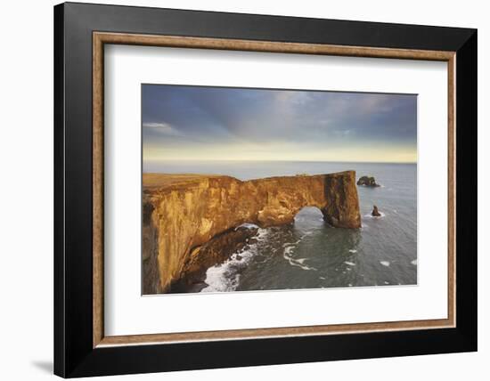 A rock arch on Dyrholaey Island seen in sunset sunlight, near Vik, south coast of Iceland-Nigel Hicks-Framed Photographic Print