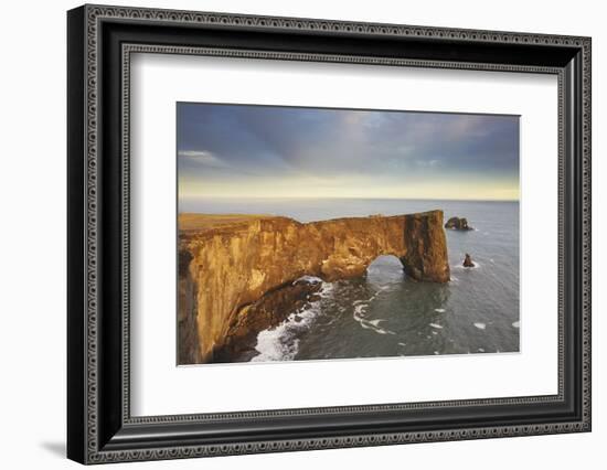 A rock arch on Dyrholaey Island seen in sunset sunlight, near Vik, south coast of Iceland-Nigel Hicks-Framed Photographic Print