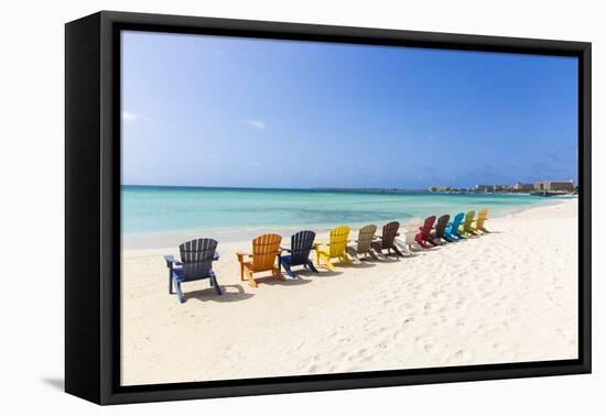 A Row of Colourful Wooden Deckchairs on Palm Beach, Aruba, Netherlands Antilles-Jane Sweeney-Framed Premier Image Canvas