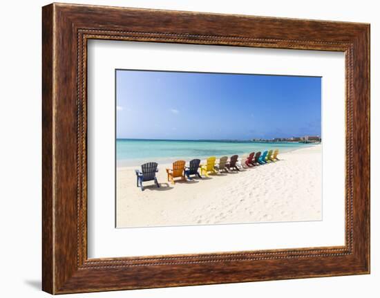 A Row of Colourful Wooden Deckchairs on Palm Beach, Aruba, Netherlands Antilles-Jane Sweeney-Framed Photographic Print