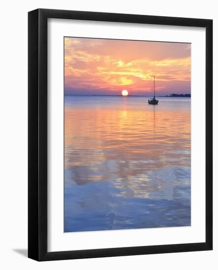 A Sailboat Silhouetted against a Brilliant Sunset in a Cove off Pensacola Bay, Florida-Colin D Young-Framed Photographic Print