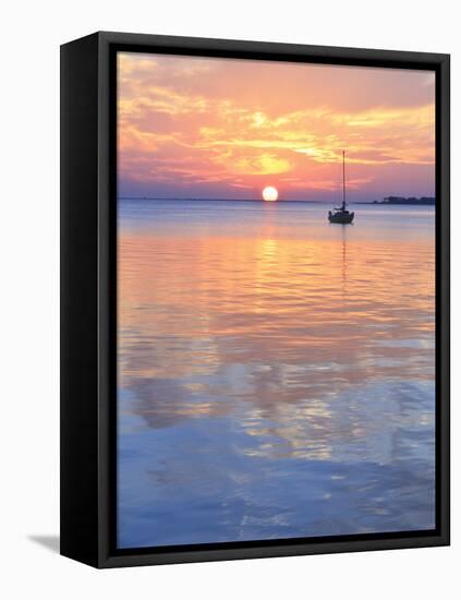 A Sailboat Silhouetted against a Brilliant Sunset in a Cove off Pensacola Bay, Florida-Colin D Young-Framed Premier Image Canvas