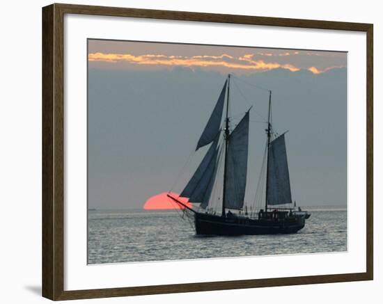 A Sailing Ship Sails During Sunset Towards the Harbor of Bremerhaven-null-Framed Photographic Print