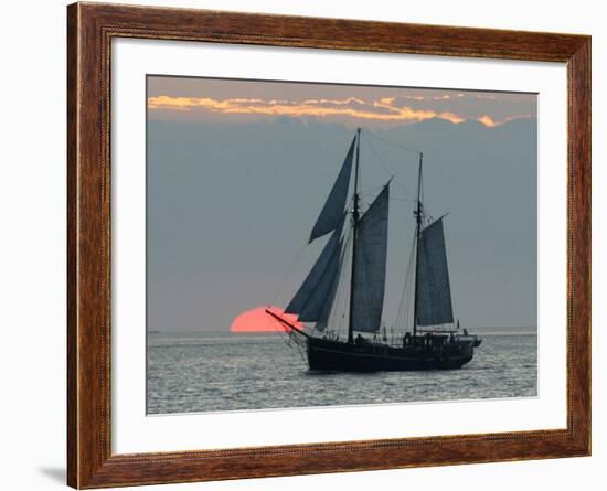 A Sailing Ship Sails During Sunset Towards the Harbor of Bremerhaven-null-Framed Photographic Print