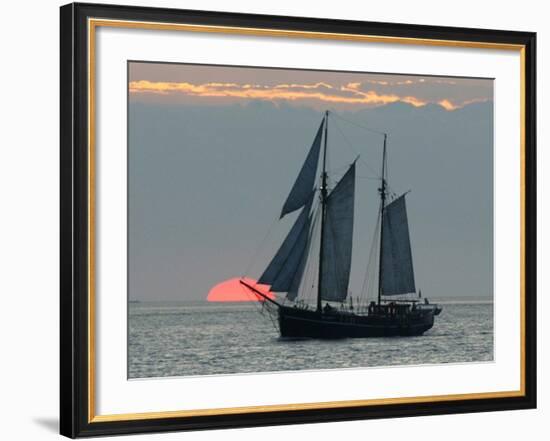 A Sailing Ship Sails During Sunset Towards the Harbor of Bremerhaven-null-Framed Photographic Print