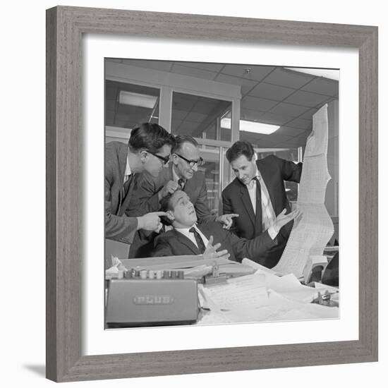 A Salesman Gets a Helping Hand in Checking the Figures, 1967-Michael Walters-Framed Photographic Print