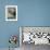 A Sea Otter Looks out from Behind a Rock-null-Framed Photographic Print displayed on a wall