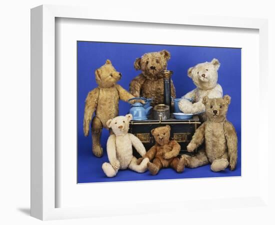 A Selection of Teddy Bears around a Black Painted Tinplate Toy Stove-null-Framed Giclee Print