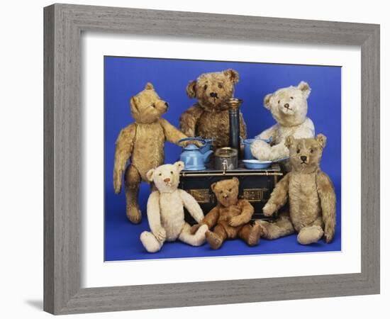 A Selection of Teddy Bears around a Black Painted Tinplate Toy Stove-null-Framed Giclee Print