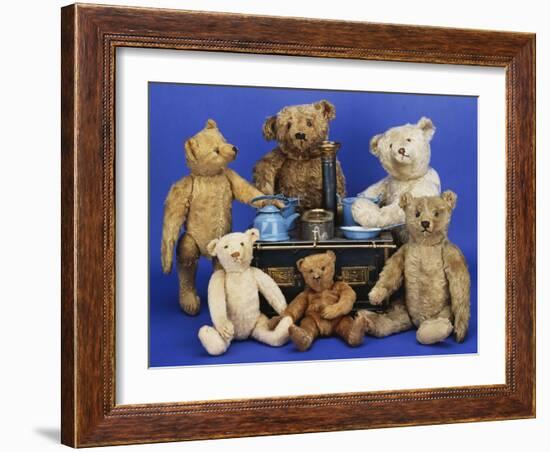 A Selection of Teddy Bears around a Black Painted Tinplate Toy Stove-null-Framed Giclee Print