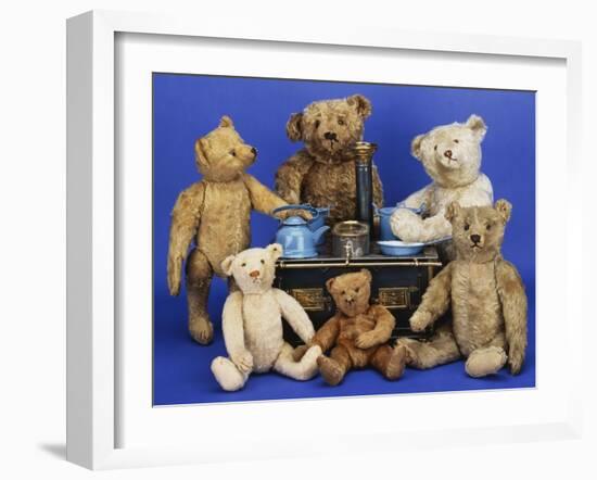 A Selection of Teddy Bears around a Black Painted Tinplate Toy Stove-null-Framed Giclee Print