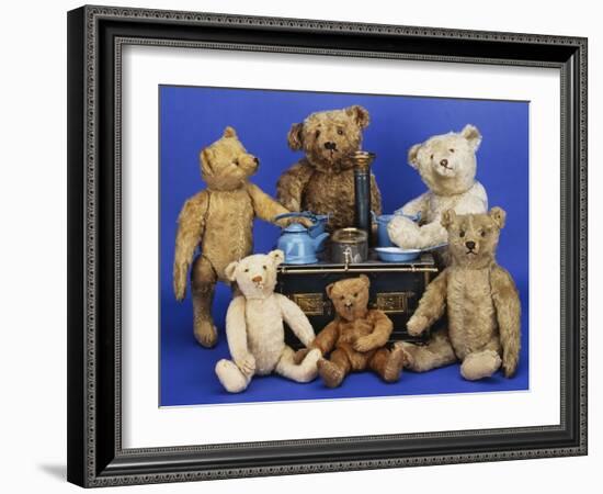 A Selection of Teddy Bears around a Black Painted Tinplate Toy Stove-null-Framed Giclee Print