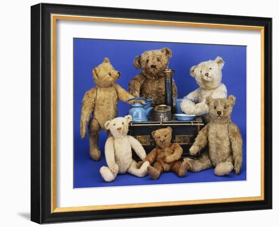 A Selection of Teddy Bears around a Black Painted Tinplate Toy Stove-null-Framed Giclee Print