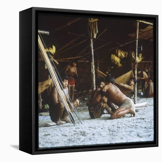 A Shaman Attempts to Heal a Sick Man by Driving Out Evil Spirits, at Mavaca, Venezuela-null-Framed Premier Image Canvas
