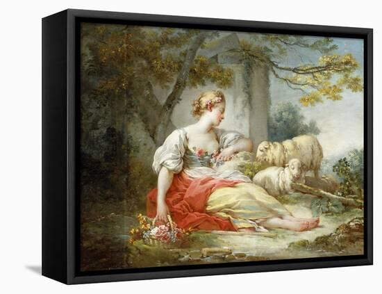 A Shepherdess Seated with Sheep and a Basket of Flowers Near a Ruin in a Wooded Landscape-Jean-Honoré Fragonard-Framed Premier Image Canvas