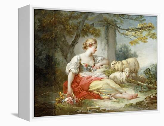 A Shepherdess Seated with Sheep and a Basket of Flowers Near a Ruin in a Wooded Landscape-Jean-Honoré Fragonard-Framed Premier Image Canvas