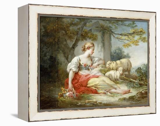 A Shepherdess Seated with Sheep and a Basket of Flowers Near a Ruin in a Wooded Landscape-Jean-Honoré Fragonard-Framed Premier Image Canvas