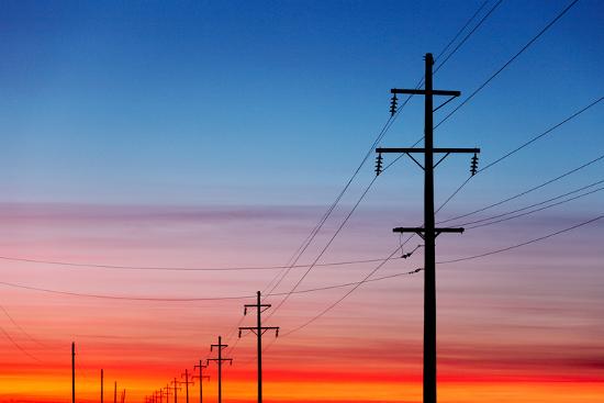 A Silhouette Of High Voltage Power Lines Against A Dramatic And Colorful Sky At Sunrise Or Sunset Photographic Print By Todd Klassy Art Com