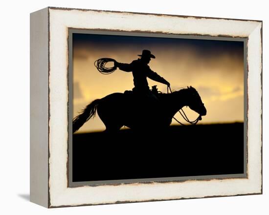 A Silhouetted Cowboy Riding Alone a Ridge at Sunset in Shell, Wyoming, USA-Joe Restuccia III-Framed Premier Image Canvas