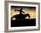 A Silhouetted Cowboy Riding Alone a Ridge at Sunset in Shell, Wyoming, USA-Joe Restuccia III-Framed Photographic Print