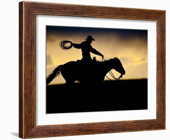 A Silhouetted Cowboy Riding Alone a Ridge at Sunset in Shell, Wyoming, USA-Joe Restuccia III-Framed Photographic Print