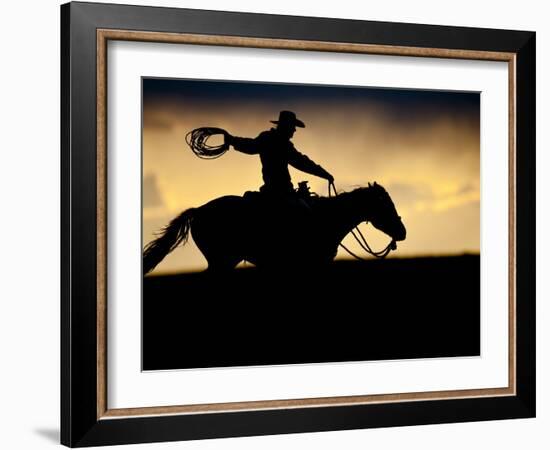 A Silhouetted Cowboy Riding Alone a Ridge at Sunset in Shell, Wyoming, USA-Joe Restuccia III-Framed Photographic Print